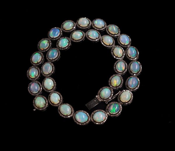 AN OPAL AND DIAMOND NECKLACE AND EARRING SET