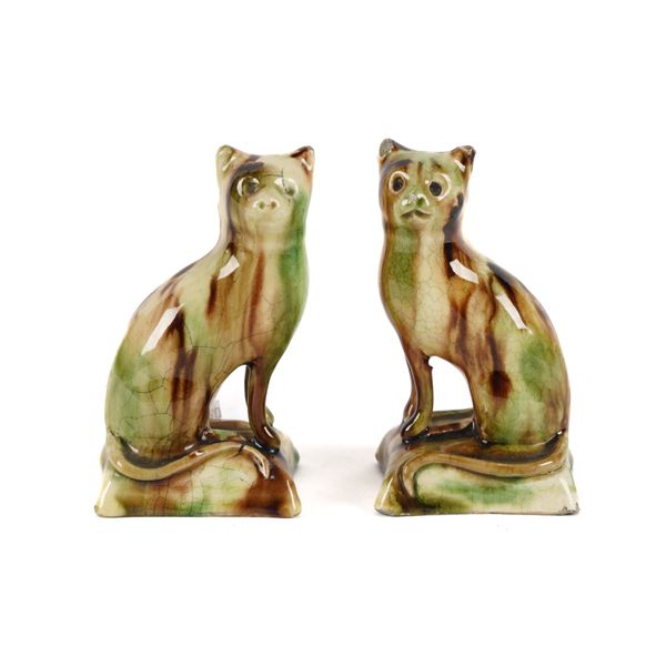 A PAIR OF WHIELDON-TYPE CREAMWARE CATS (2)