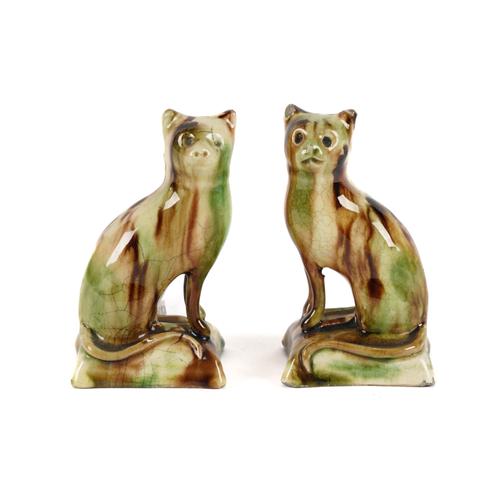 A PAIR OF WHIELDON-TYPE CREAMWARE CATS (2)