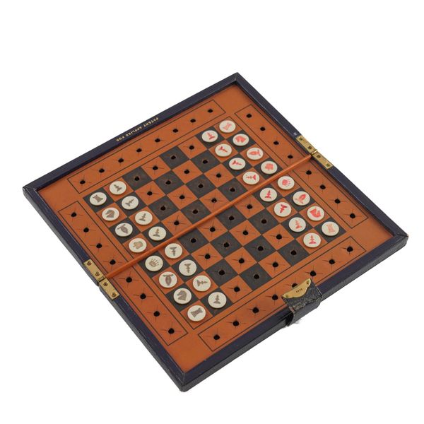 AN EDWARDIAN PATENT TRAVEL LEATHER AND BONE CHESS SET (33)