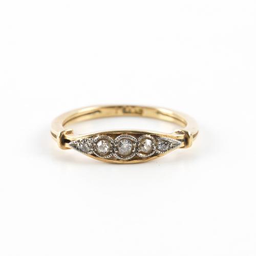 A GOLD AND DIAMOND FIVE STONE RING