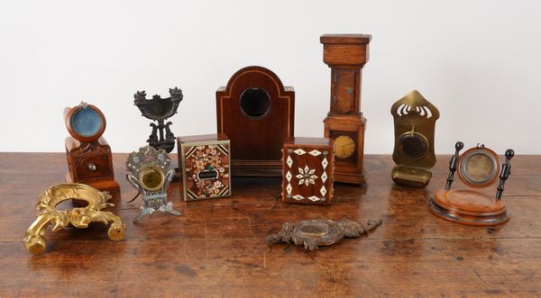 A COLLECTION OF NOVELTY POCKET WATCH STANDS INCLUDING ONE MODELLED AS A LONGCASE CLOCK (11)