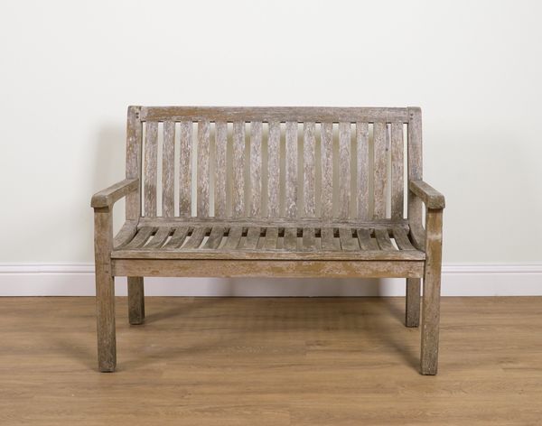 A SLATTED TEAK GARDEN BENCH