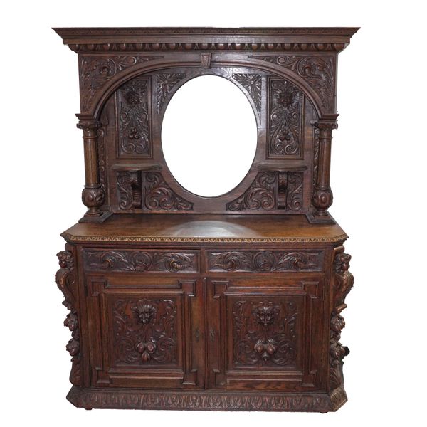 A VICTORIAN CARVED OAK MIRRORED BACK SIDEBOARD
