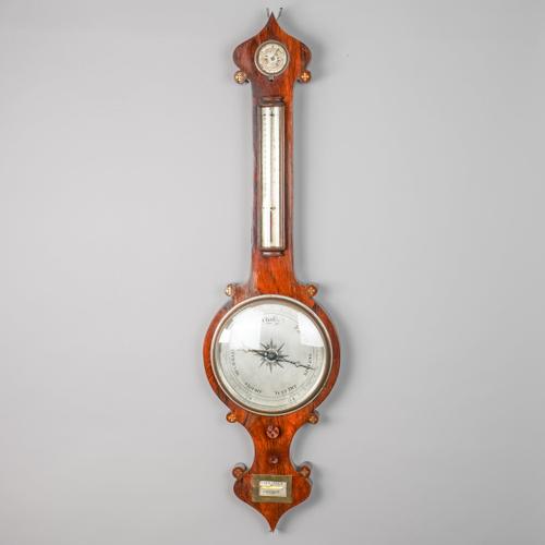 A LATE REGENCY ROSEWOOD AND BRASS-INLAID WHEEL BAROMETER