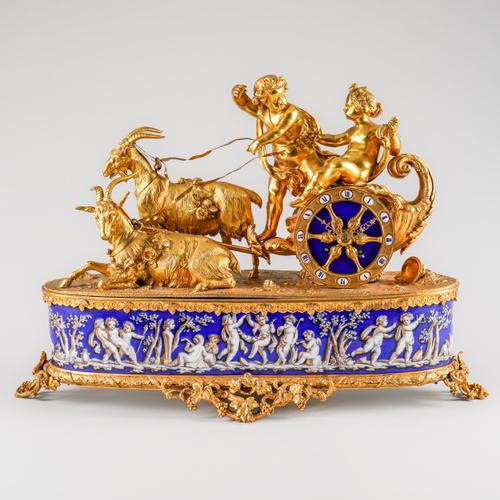 A FRENCH ORMOLU AND LIMOGES ENAMEL STYLE PORCELAIN MANTEL CLOCK