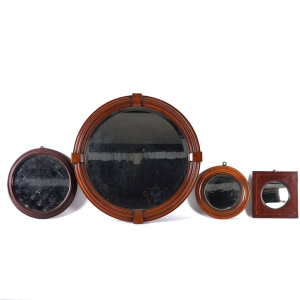 A MAHOGANY FRAMED CIRCULAR WALL MIRROR (4)