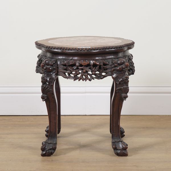 AN EARLY 20TH CENTURY CHINESE EXPORT CARVED HARDWOOD INSET MARBLE JARDINIERE STAND