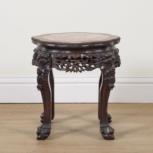 AN EARLY 20TH CENTURY CHINESE EXPORT CARVED HARDWOOD INSET MARBLE JARDINIERE STAND