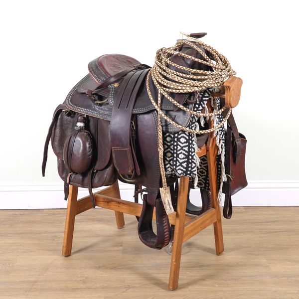 A WESTERN LEATHER SADDLE AND ACCOMPANYING ACCESSORIES