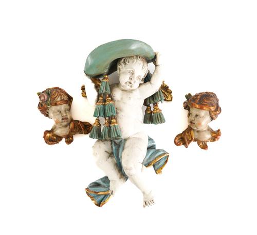 A PAIR OF CARVED WOOD POLYCHROME CHERUB HEADS AND WINGED PUTTO (3)