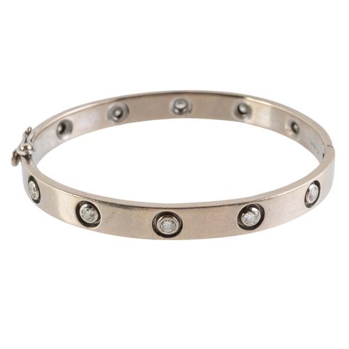 A WHITE GOLD AND DIAMOND SET BANGLE