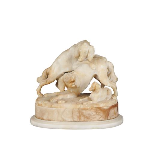 AN ALABASTER GROUP OF DOGS FIGHTING OVER PREY