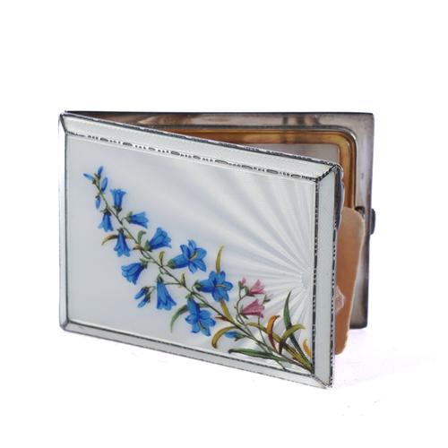 A LADY'S SILVER AND ENAMELLED RECTANGULAR POWDER COMPACT