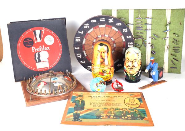 A GROUP OF VINTAGE TOYS AND GAMES INCLUDING AN EARLY DART BOARD