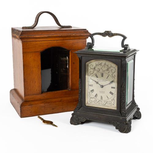 AN ENGLISH PATINATED BRONZE STRIKING CARRIAGE CLOCK WITH ORIGINAL OAK CASE