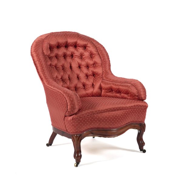 A PATTERNED RED UPHOLSTERED BUTTONBACK EASY ARMCHAIR