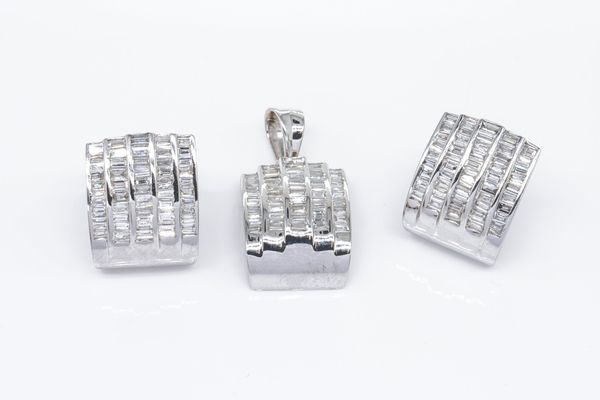 A DIAMOND PENDANT AND EARRING SET