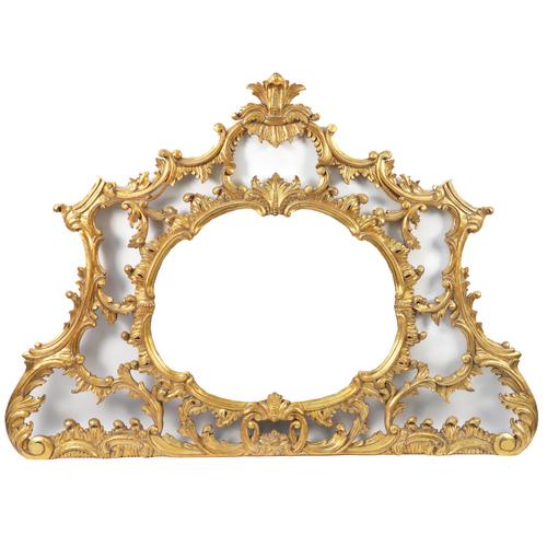 A ROCOCO REVIVAL GILT FRAMED OVERMANTEL MIRROR