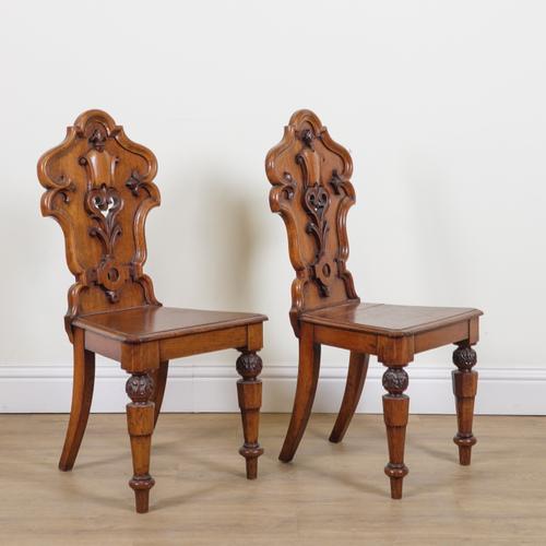 A PAIR OF VICTORIAN OAK HALL CHAIRS (2)