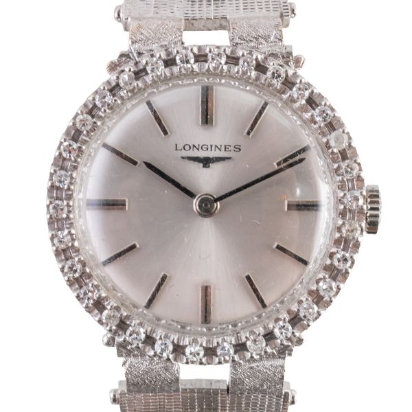 AN 18CT GOLD AND DIAMOND LONGINES WATCH