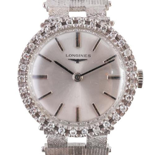 AN 18CT GOLD AND DIAMOND LONGINES WATCH