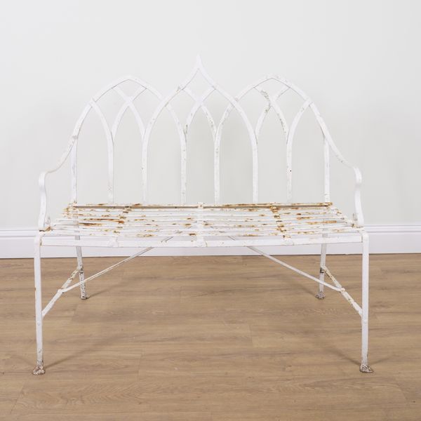 A REGENCY STYLE WHITE PAINTED STRAP IRON GARDEN BENCH