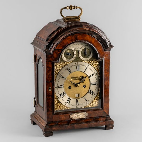 A GEORGE II FRUITWOOD AND LATER WALNUT-VENEERED QUARTER REPEATING AND STRIKING BRACKET CLOCK