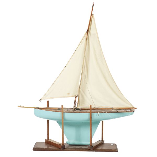 A BLUE PAINTED POND YACHT ON STAND