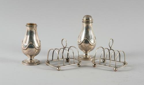 TWO SILVER TOASTRACKS AND A PAIR OF FRENCH CASTERS (4)