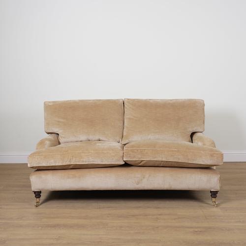A MODERN THREE SEAT SOFA