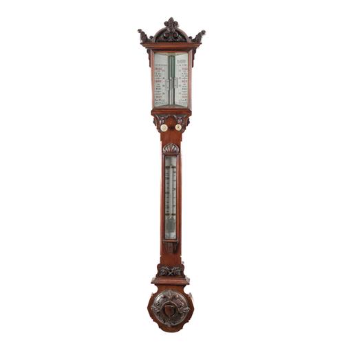 A LARGE VICTORIAN CARVED WALNUT STICK BAROMETER