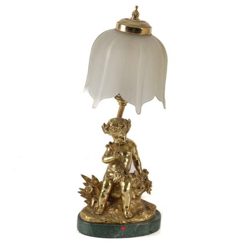 A FRENCH GILT-BRONZE PIPE PLAYING CHERUB MOUNTED AND ADAPTED AS A TABLE LAMP (2)