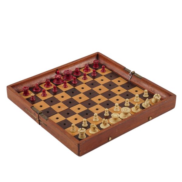 A JAQUES ‘IN STATU QUO’ RED AND WHITE BONE TRAVEL CHESS SET (33)