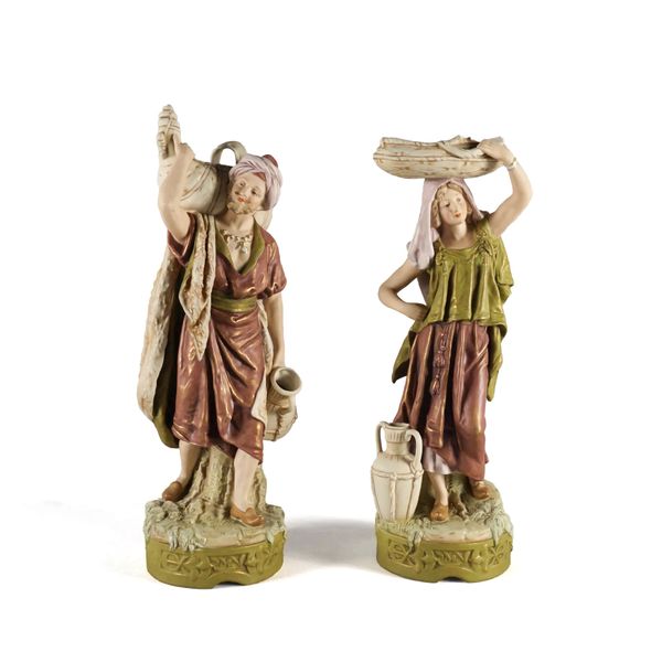 A LARGE PAIR OF ROYAL DUX FIGURES OF WATER CARRIERS (2)