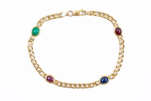 A CURB LINK GEM SET BRACELET