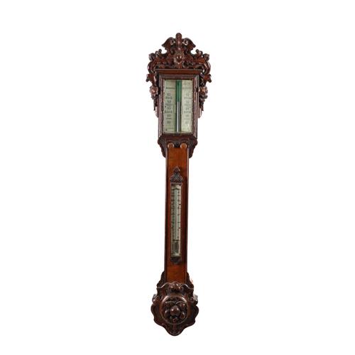 A LARGE VICTORIAN CARVED OAK STICK BAROMETER