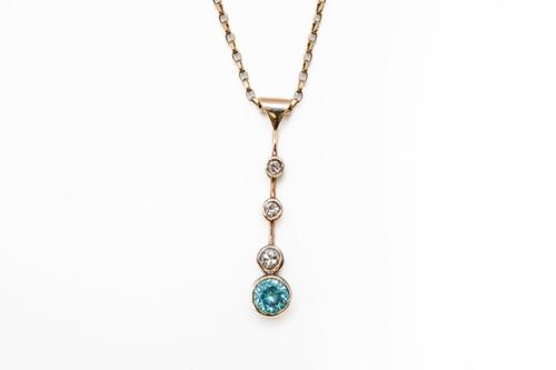 A ZIRCON AND DIAMOND PENDANT NECKLACE
