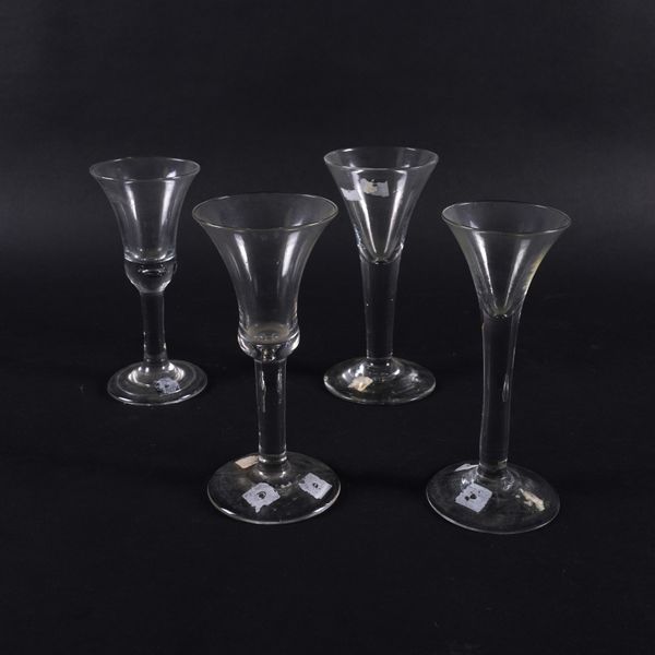 FOUR PLAIN STEMMED WINE GLASSES (4)