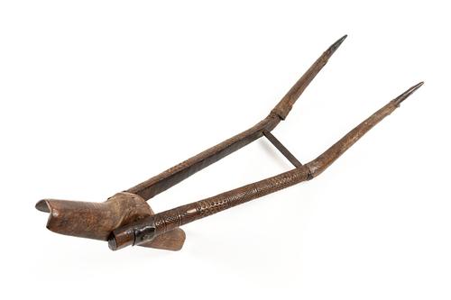 AN INDO-PERSIAN CARVED WOODEN MUSKET REST