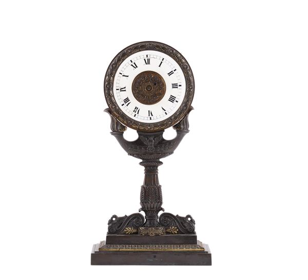 A LATE REGENCY GILTMETAL AND BRONZE NIGHT CLOCK