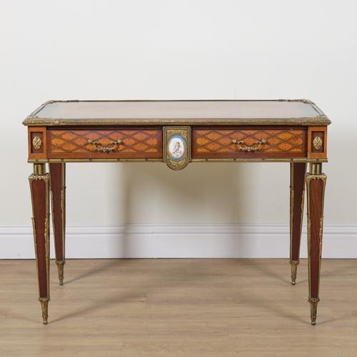 A LOUIS XVI STYLE GILT METAL MOUNTED PARQUETRY INLAID FRUITWOOD AND EBONISED RECTANGULAR CENTRE WRITING TABLE
