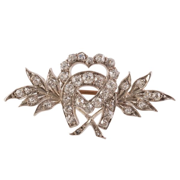 A HEART AND HORSESHOE BROOCH
