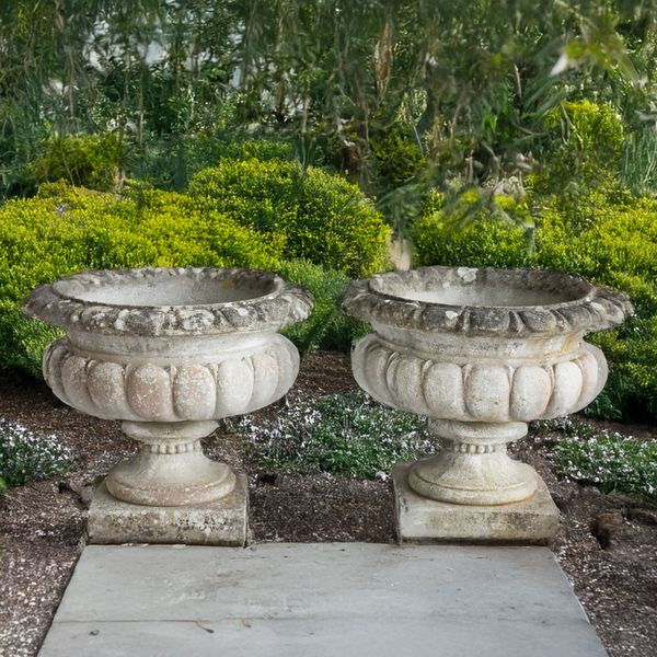 A PAIR OF RECONSTITUTED STONE CIRCULAR JARDINIÈRES (2)