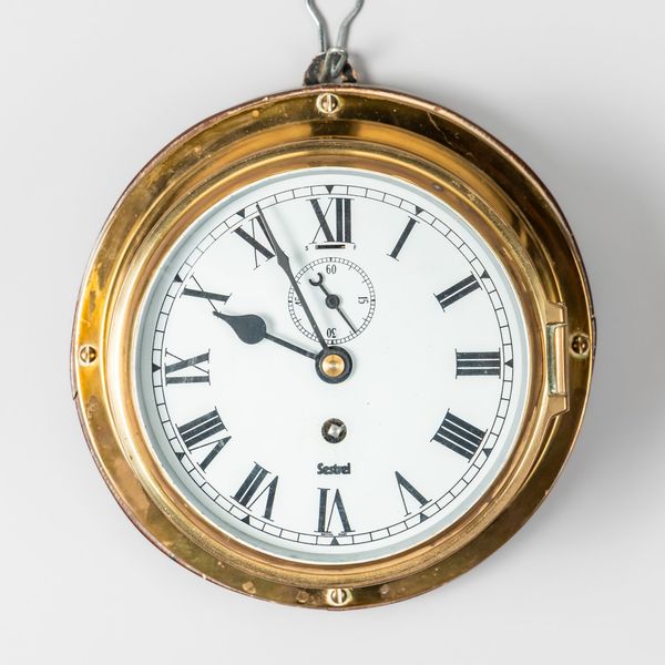 A BRASS BULKHEAD TIMEPIECE