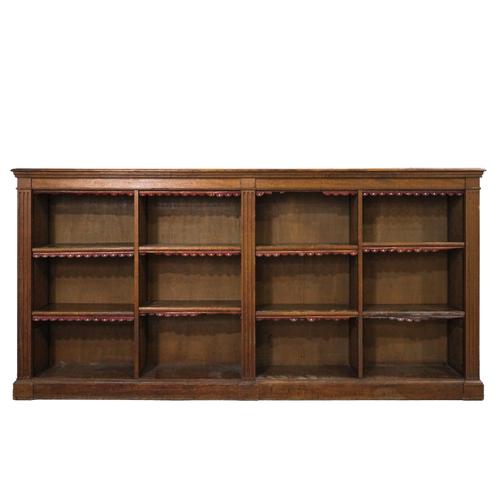 A VICTORIAN AND LATER OAK OPEN BOOKCASE