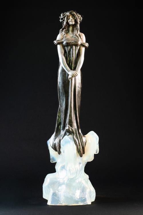 JULIEN CAUSSE (FRENCH 1869-1914): AN ART NOUVEAU SILVERED AND PATINATED BRONZED SPELTER FIGURE ‘FEE DES GLACES’ OR 'THE ICE MAIDEN'