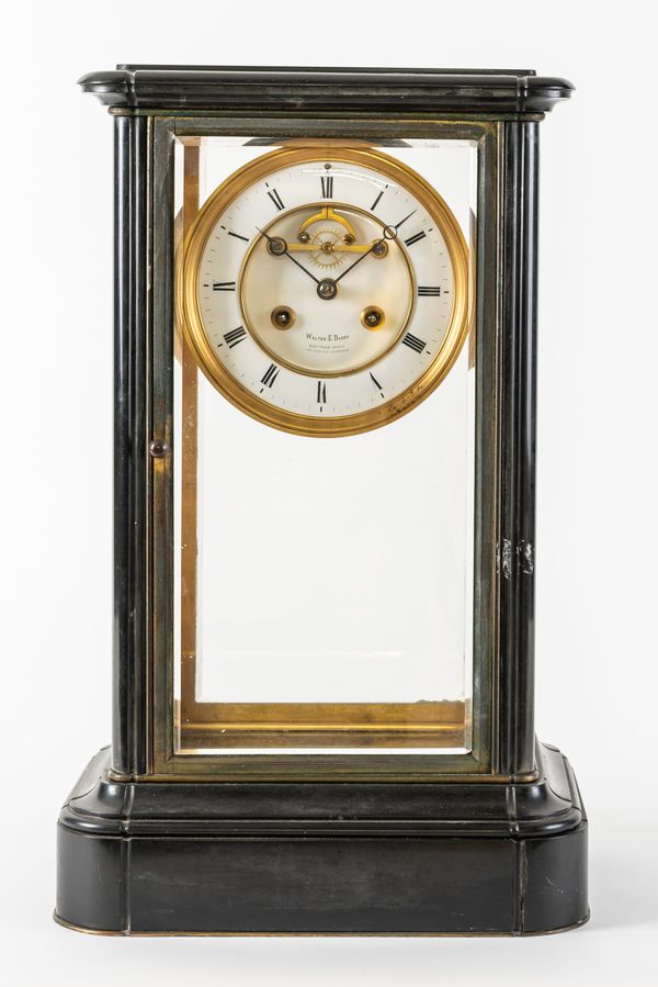 A FRENCH GILT BRASS AND BLACK MARBLE FOUR-GLASS MANTEL CLOCK