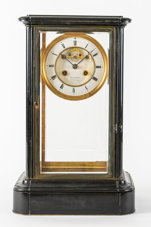 A FRENCH GILT BRASS AND BLACK MARBLE FOUR-GLASS MANTEL CLOCK