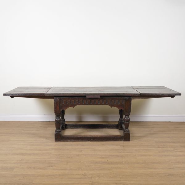 A 17TH CENTURY AND LATER OAK DRAW LEAF EXTENDING TABLE
